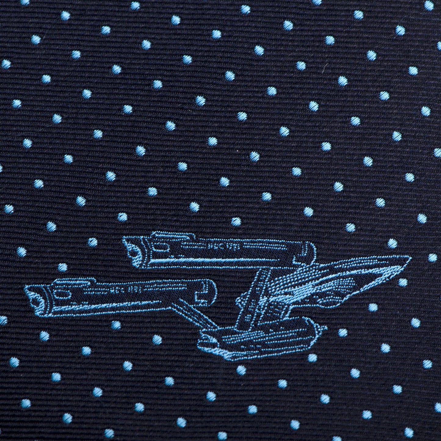 Angled shot showing the slim profile and silk texture of the Star Trek tie