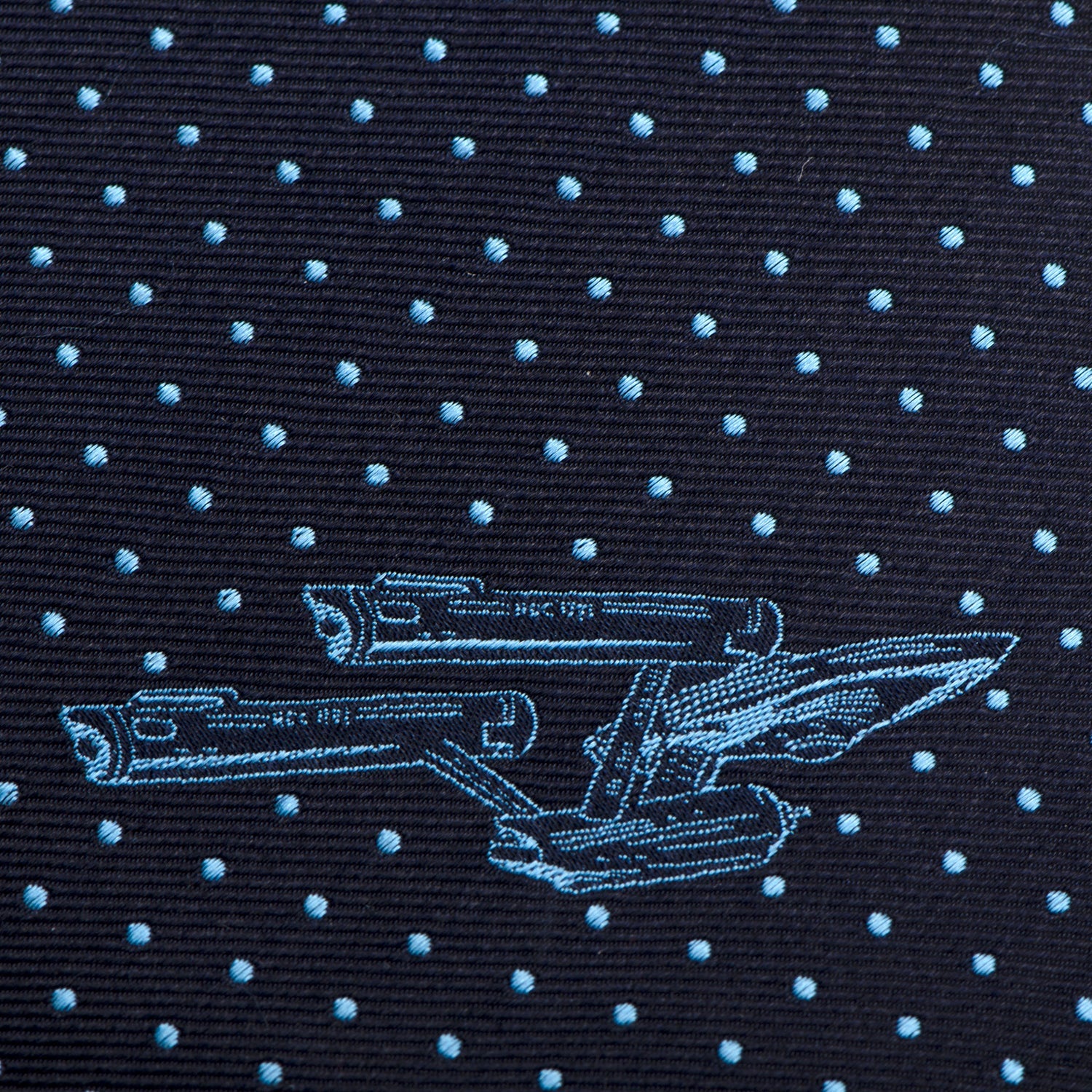 Angled shot showing the slim profile and silk texture of the Star Trek tie