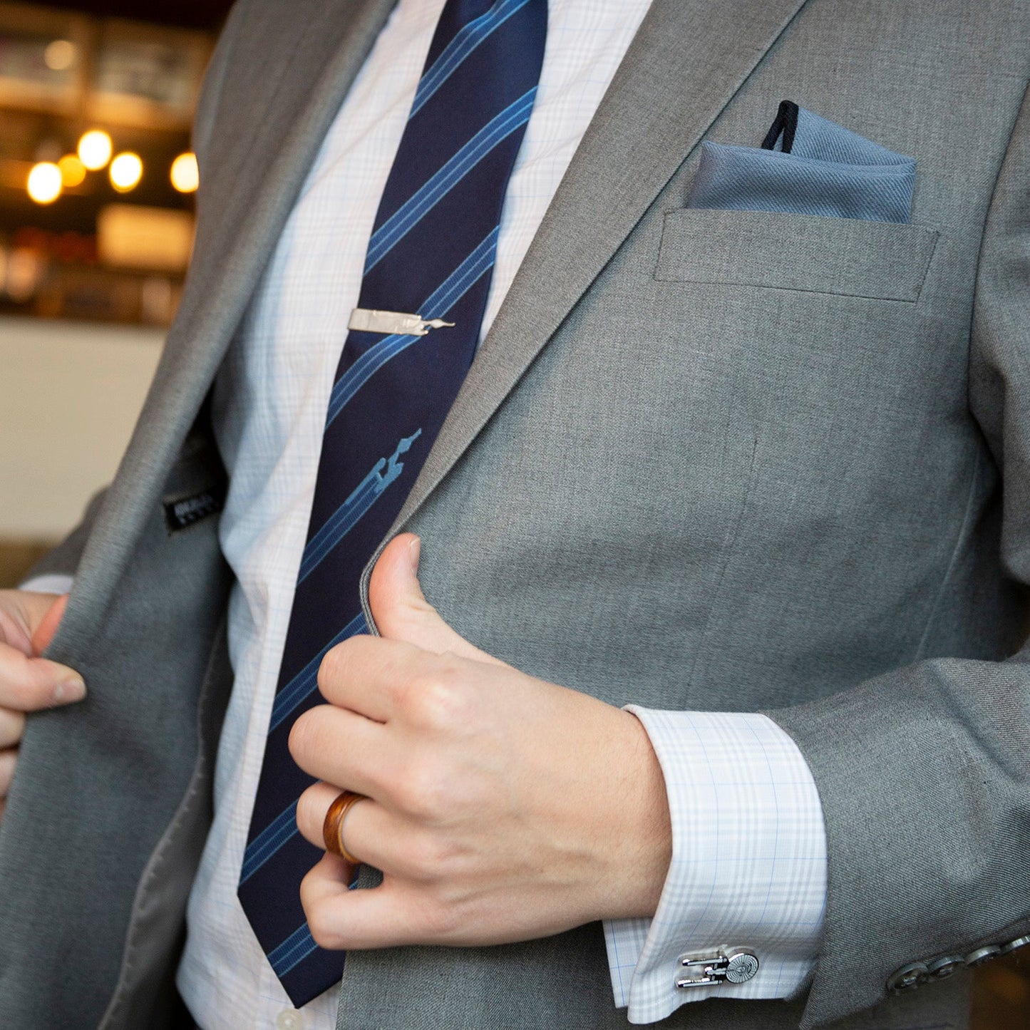 Angled view showing the metallic finish of the Enterprise tie bar