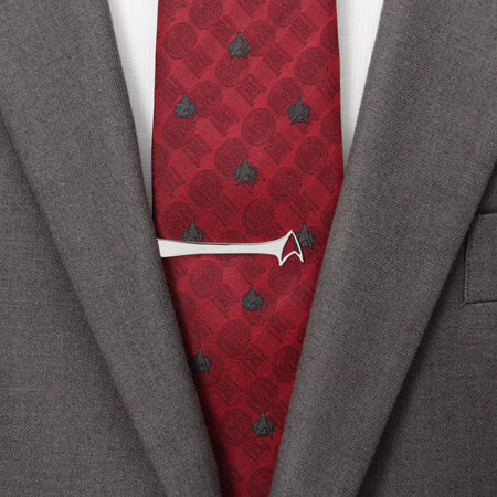 Detail shot of the Starfleet Delta insignia cutout on a silver tie bar