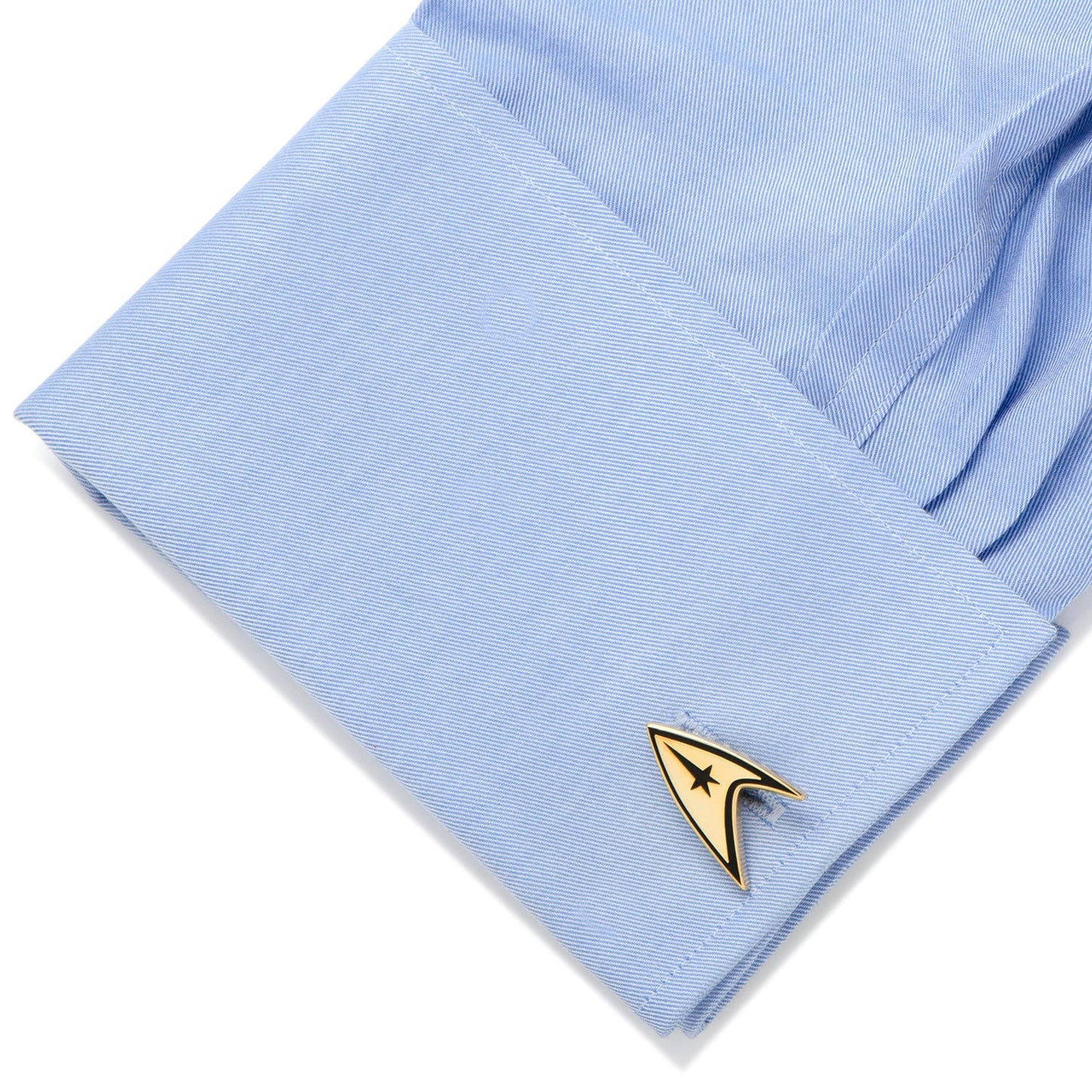 The reverse side of the cufflink showing the Star Trek logo on a round base