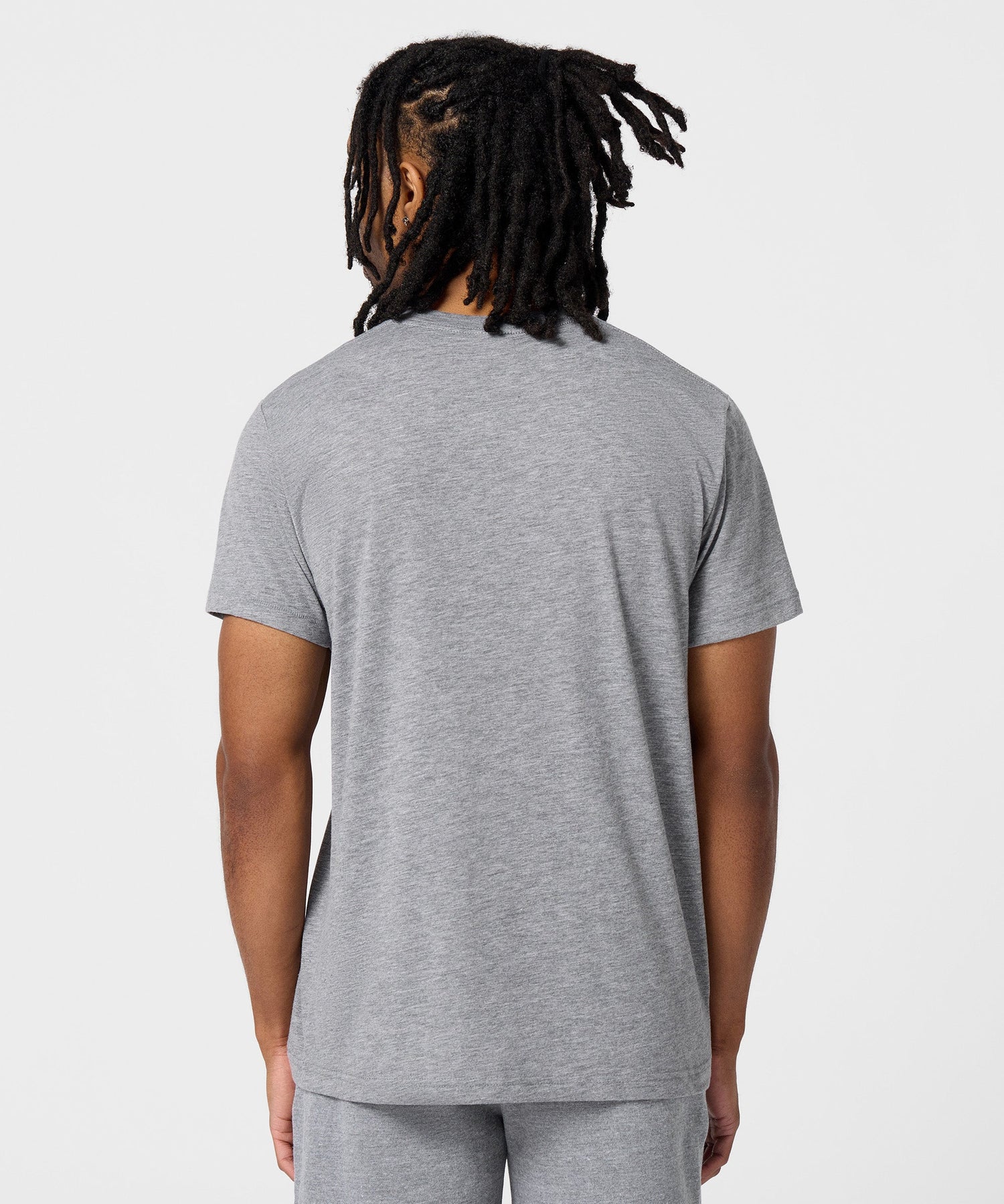Close-up detail of the HOMAGE brand tag printed inside the neckline