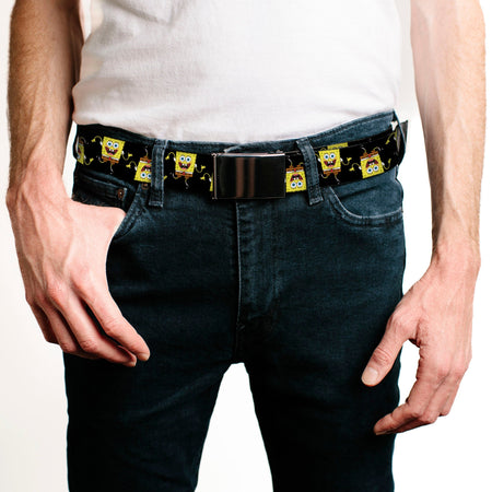 A person wears a white t-shirt, dark jeans, and a black belt with Spongebob characters. One hand is in a pocket.