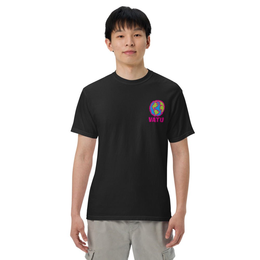 Young East Asian man in black t-shirt with colorful globe logo & 'VATU' text on chest, grey pants, white background.
